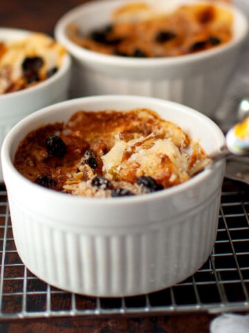 White ramekins with baked Oum ali.