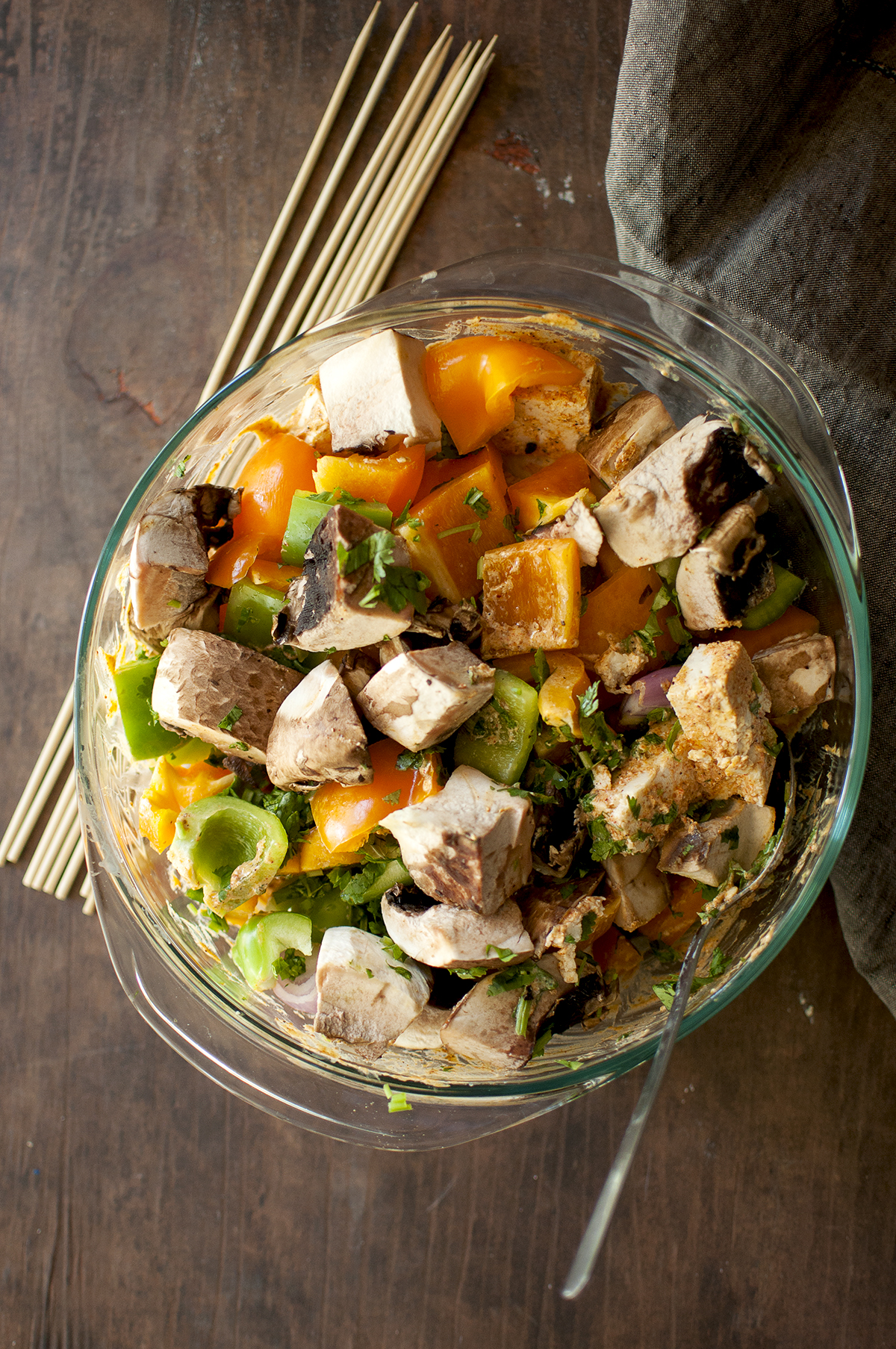 Glass bowl with tofu and veggies in marinade