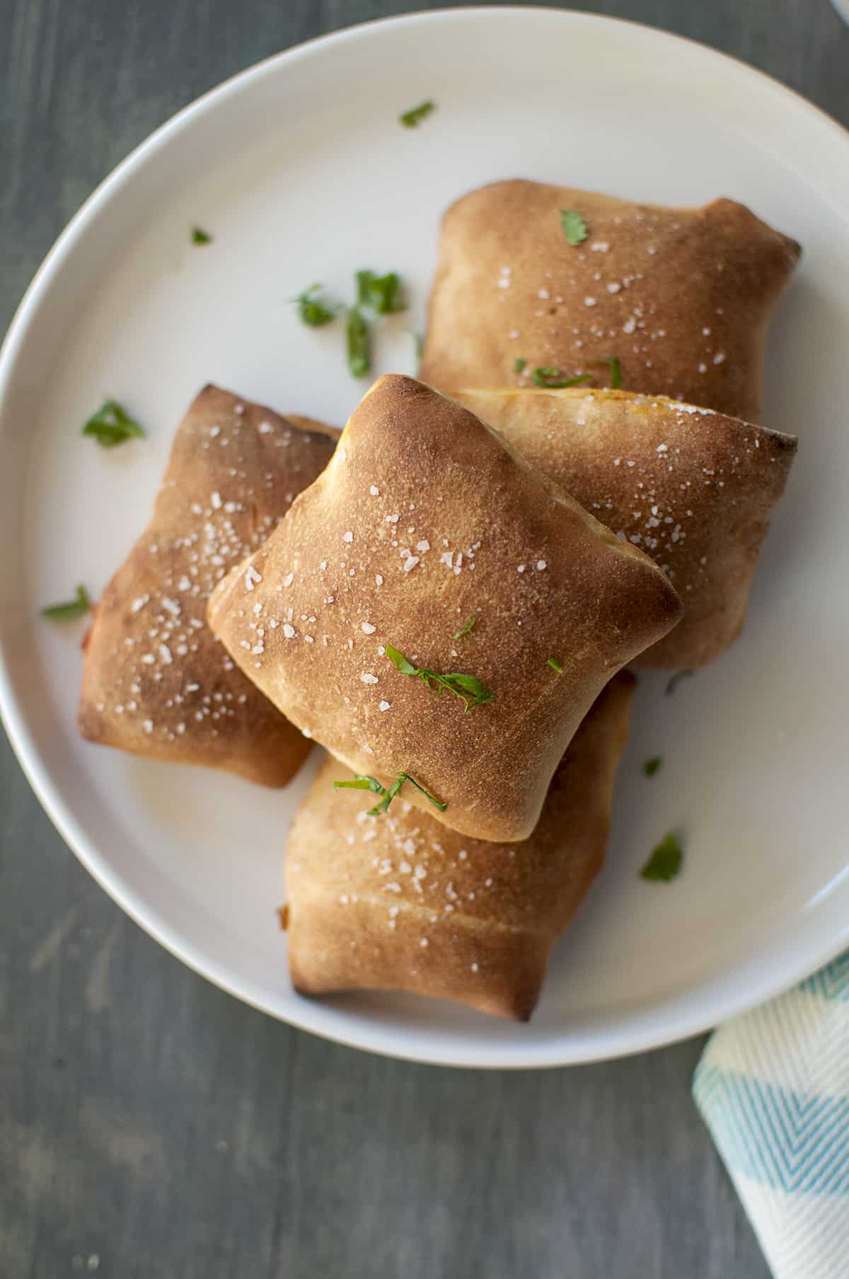 White plate with a stack of cheese pizza pops