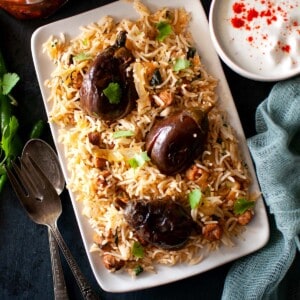 Top view of rectangle plate with eggplant pilaf.
