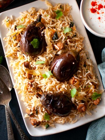 Top view of rectangle plate with eggplant pilaf.