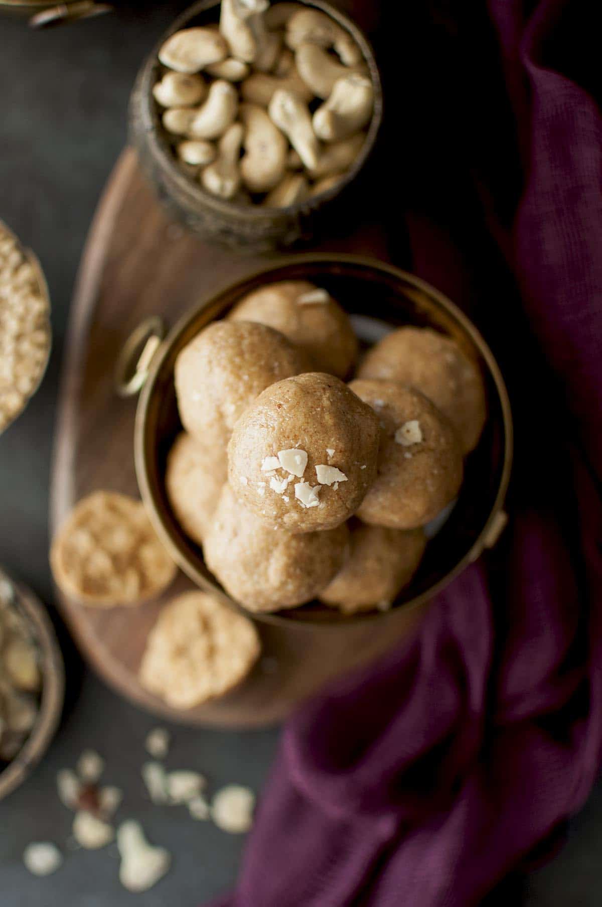 Top view of urad dal ladoo topped with nuts