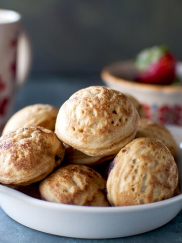 White plate with stack of Danish Aebleskivers