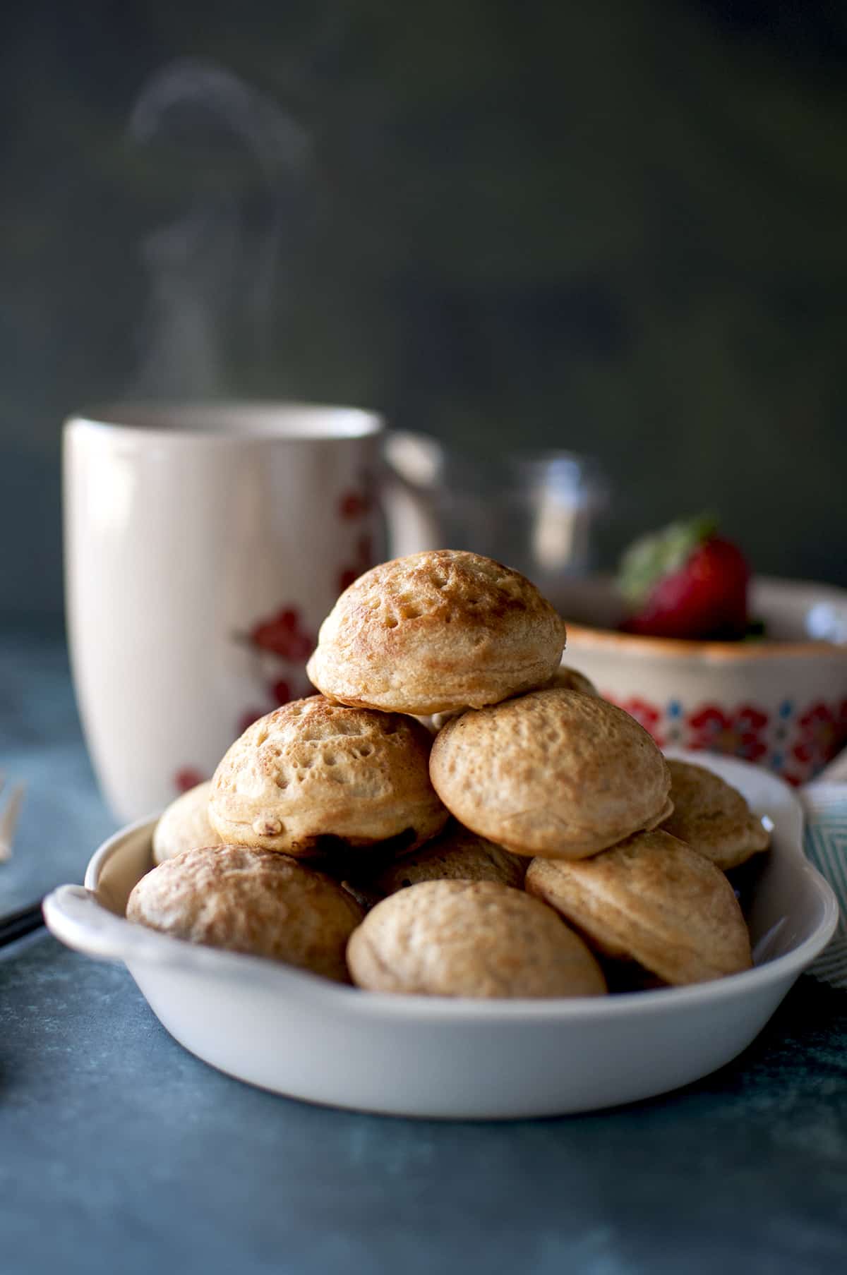 White plate with a stack of Danish pancake balls