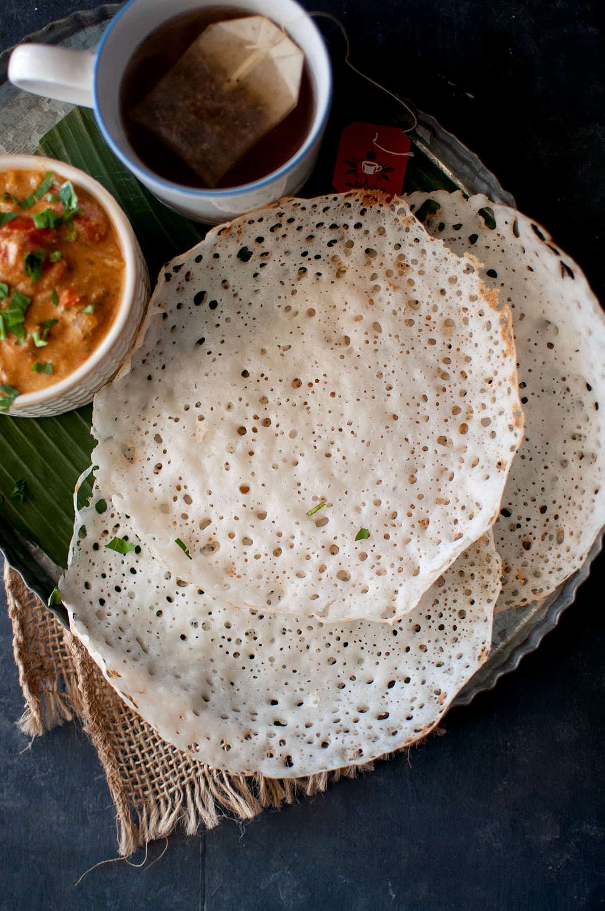 Tray with stack of instant appam.