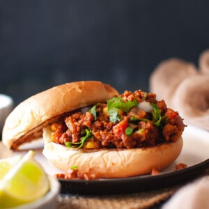 Black plate with Indian sloppy joes.