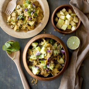 Wooden bowl and plates with Raw Mango Salad