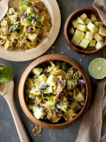 Wooden bowl and plates with Raw Mango Salad