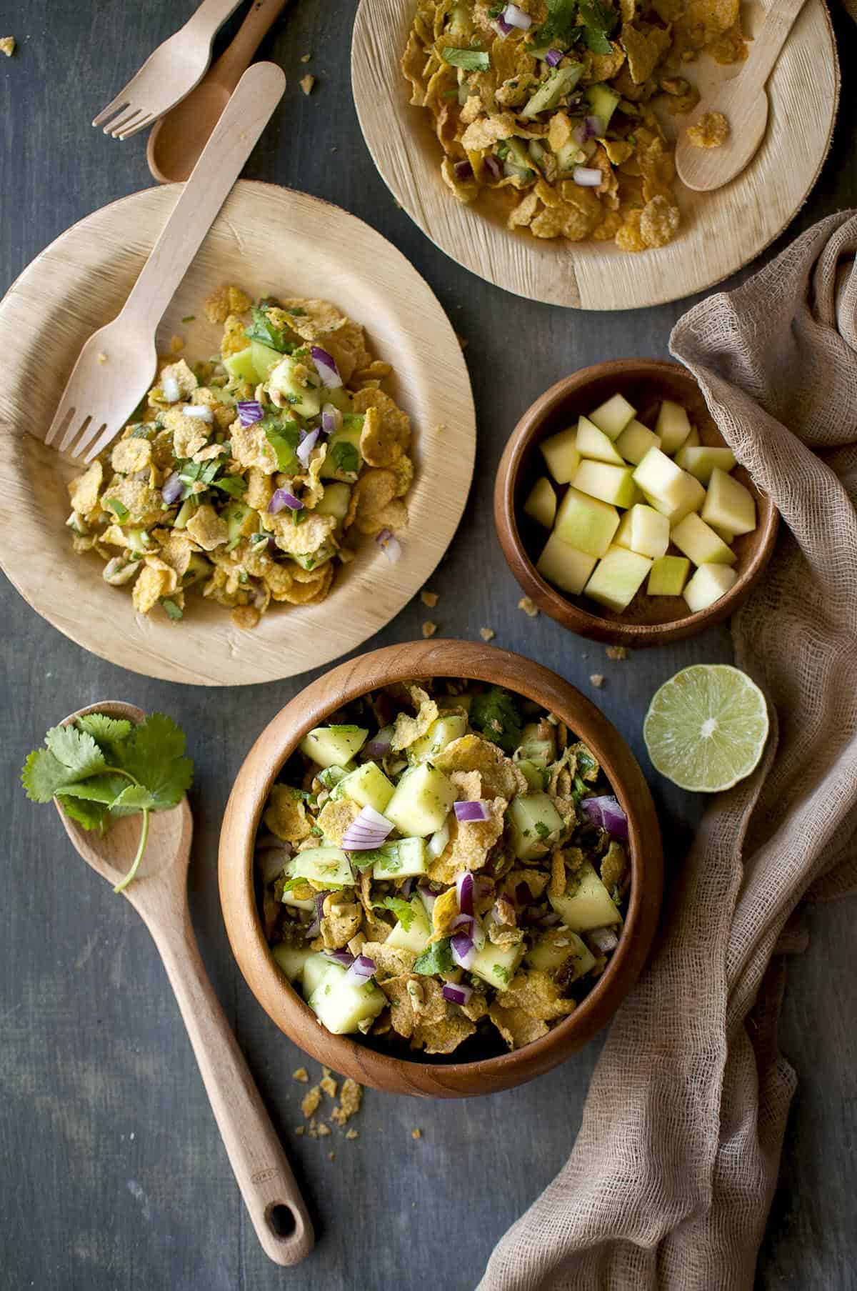 Board with bowls of raw mango chat