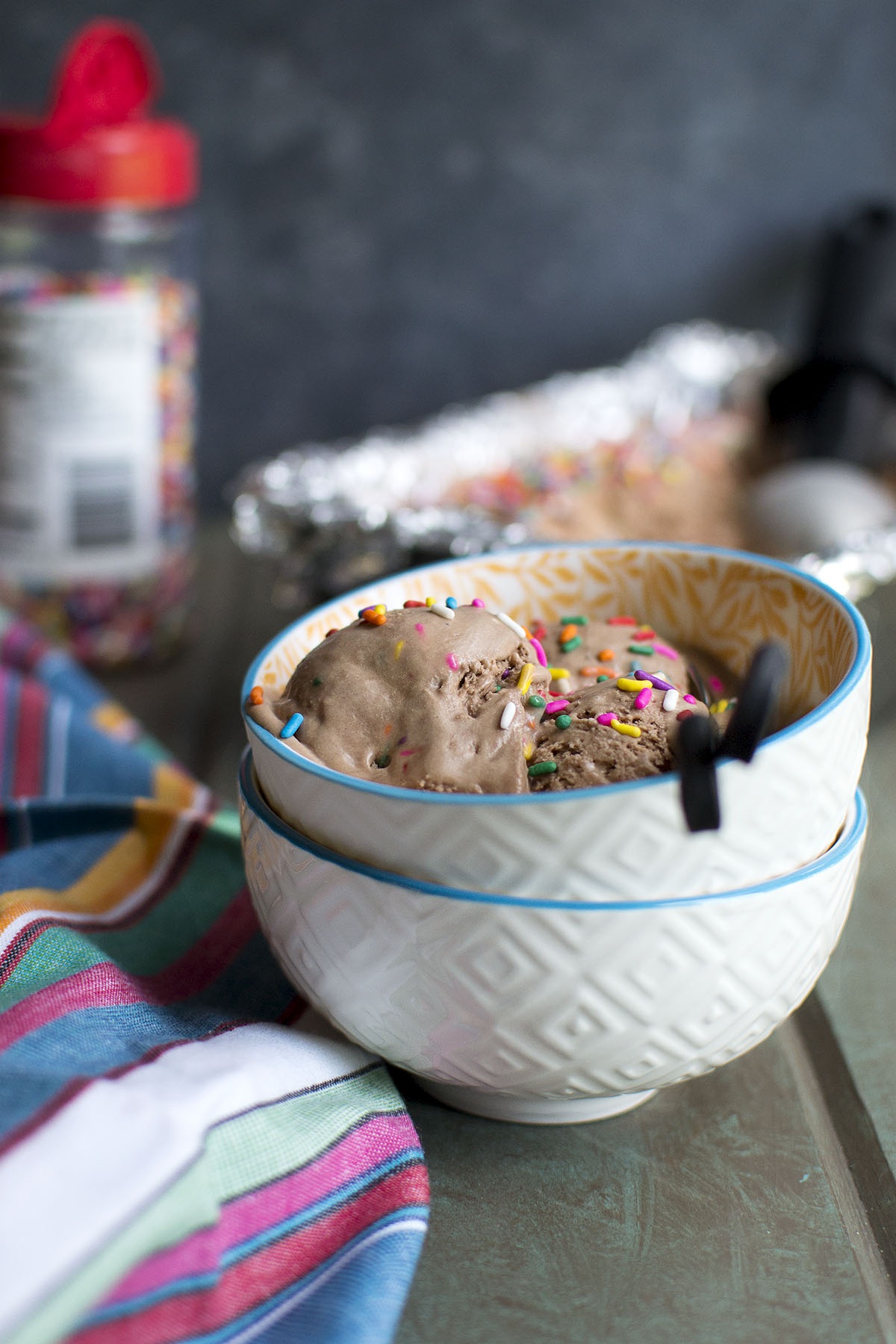 2 white bowls with chocolate ice cream