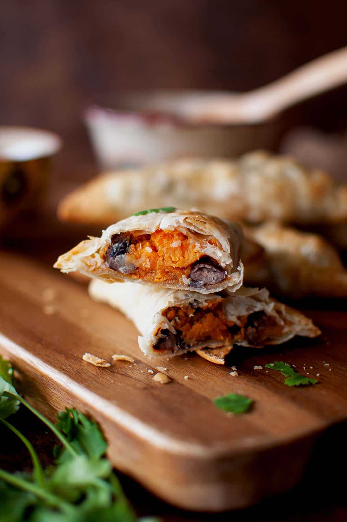 Chopping board with halved savory pastry