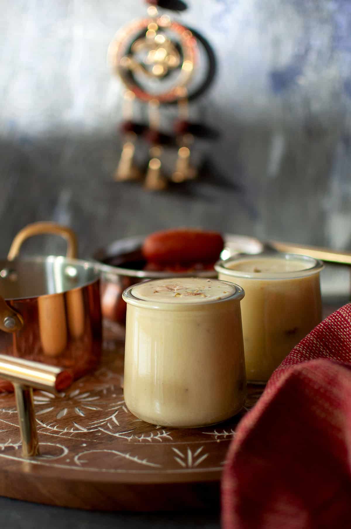 Gulab Jamun with Rabri - Cook's Hideout 5 Wooden tray with glass jars with rabri with gulab jamun.