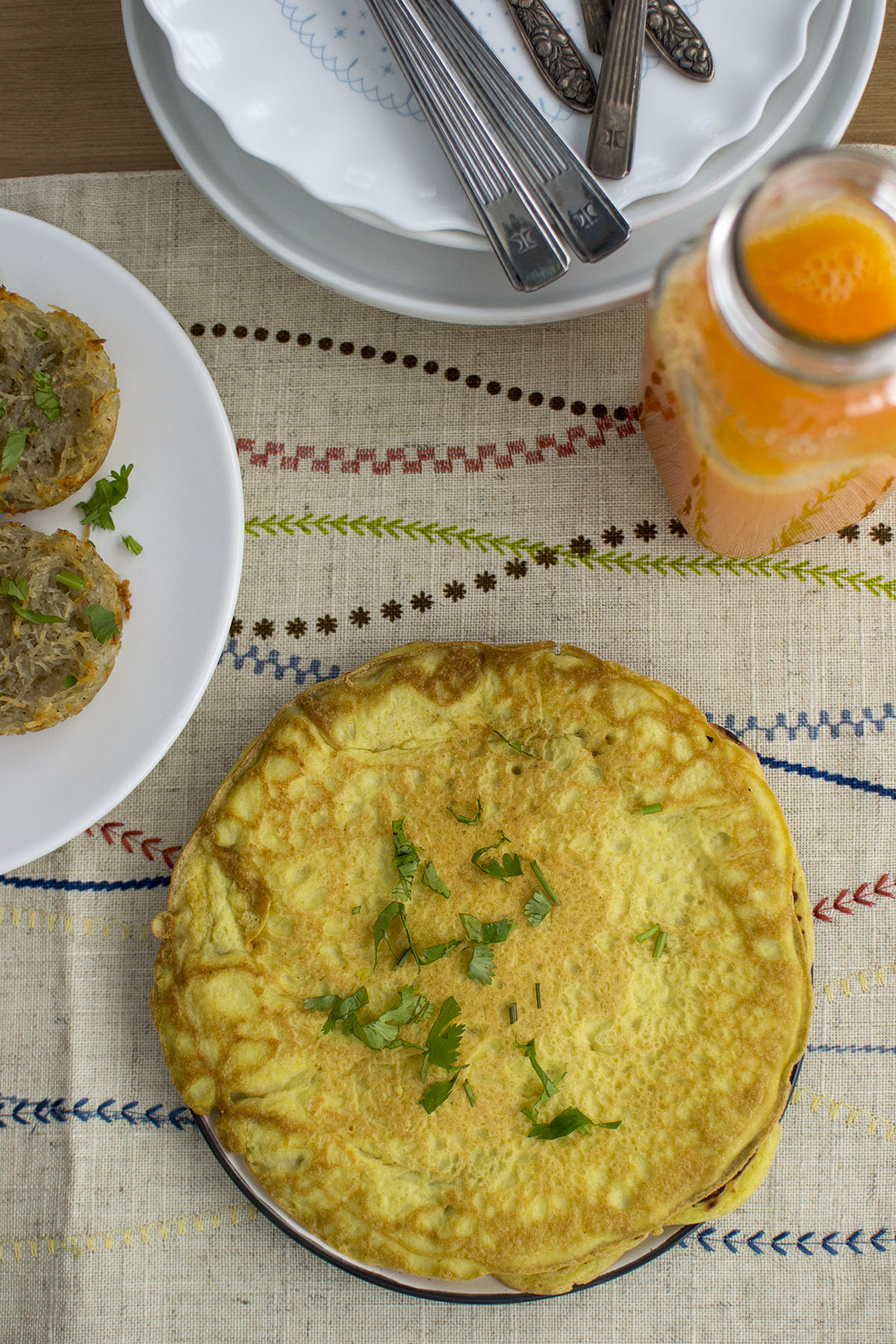 Plate with omelette with cilantro garnish