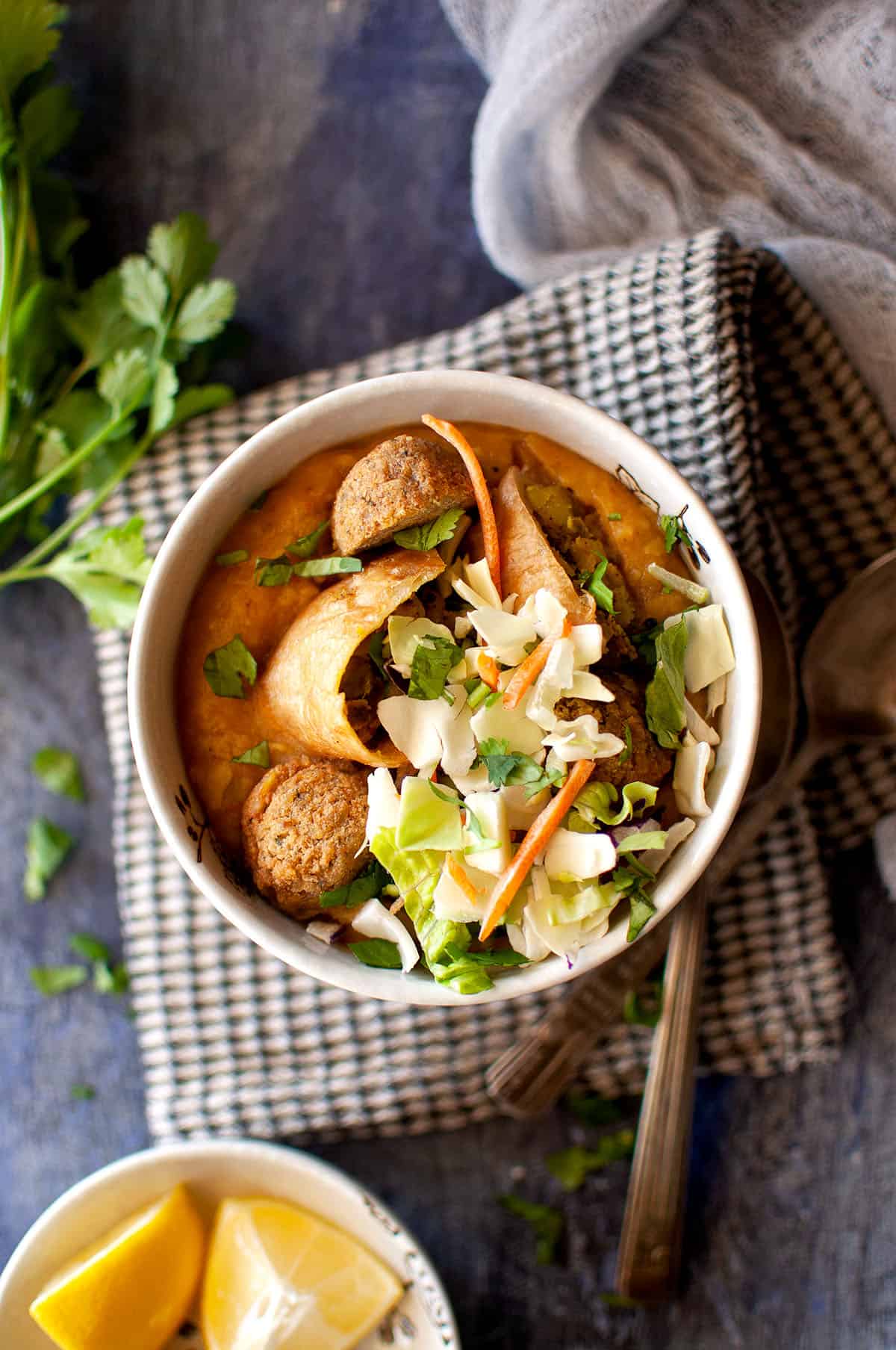 White bowl with Burmese samosa soup.