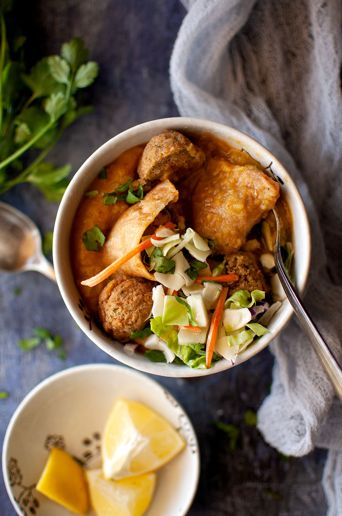 Top view of a white bowl with samusa soup.