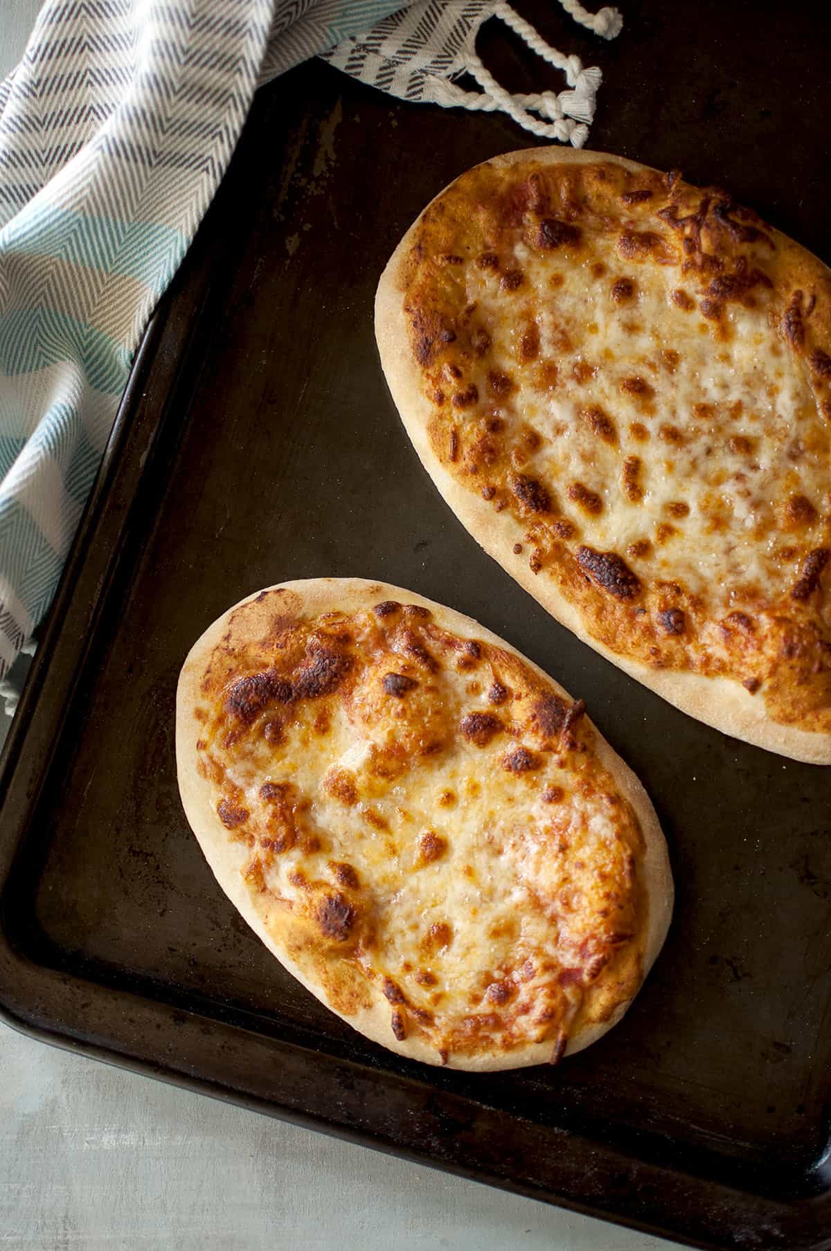 Baking tray with 2 cheese pizza