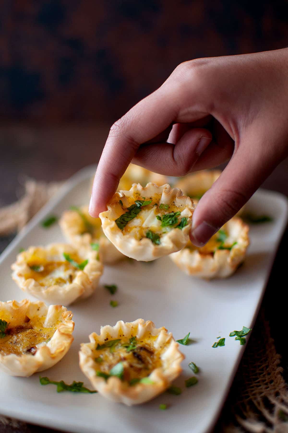 Hand holding a phyllo pastry cup.