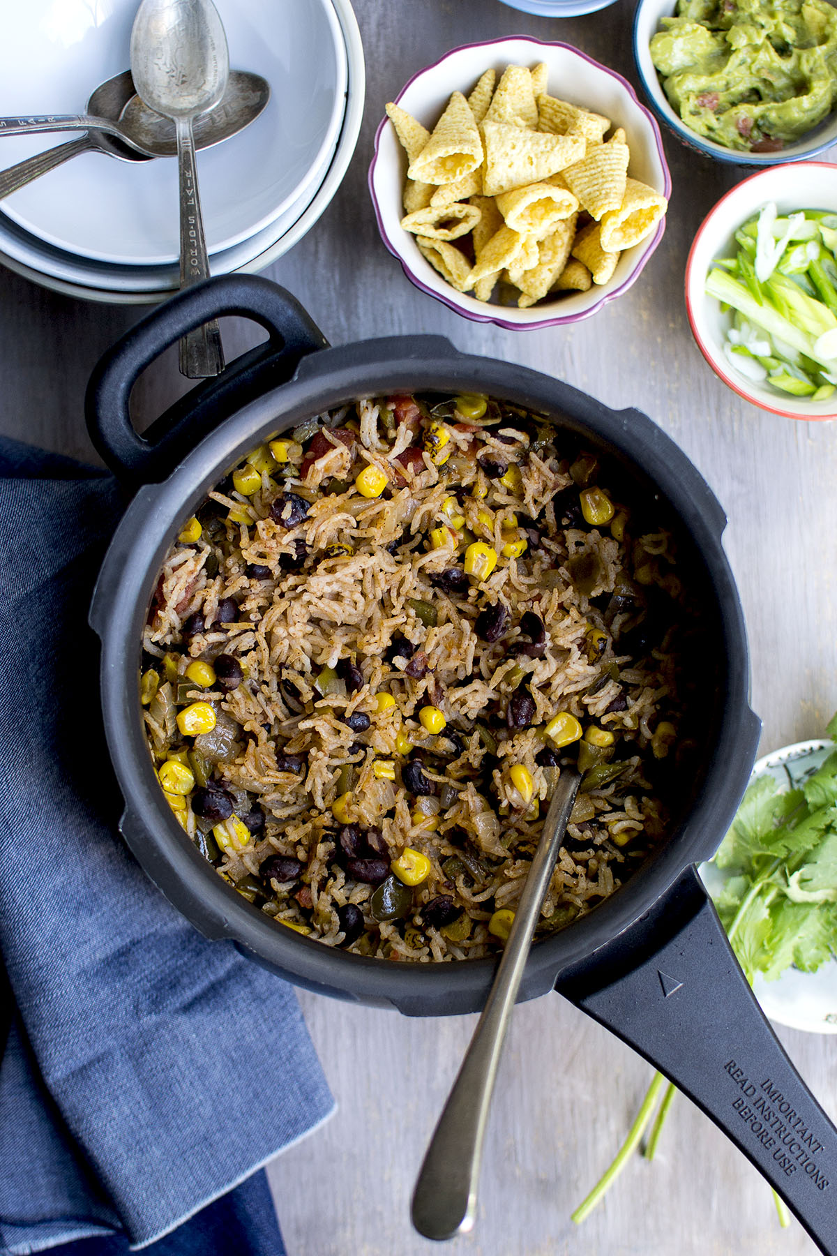 Pressure cooker with rice, corn, black beans.