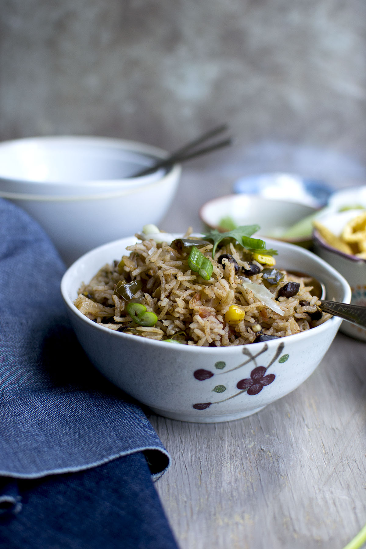 Grey bowl with black beans and rice.