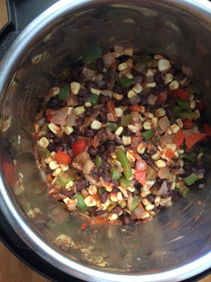 Cooked onions, peppers, corn, black beans in instant pot