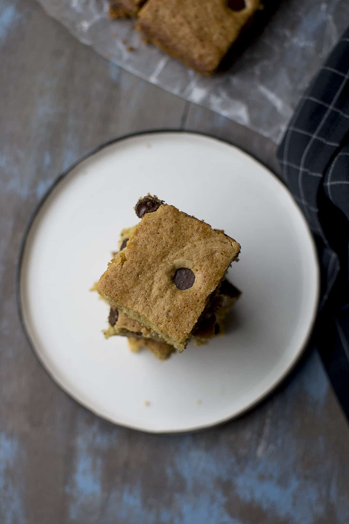 White plate with a stack of blondies