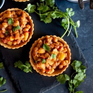 board with Chana chaat tart tartlets