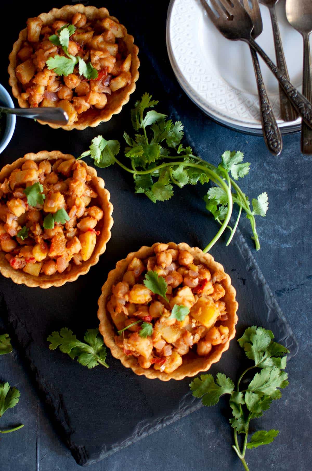 board with Chana chaat tart tartlets