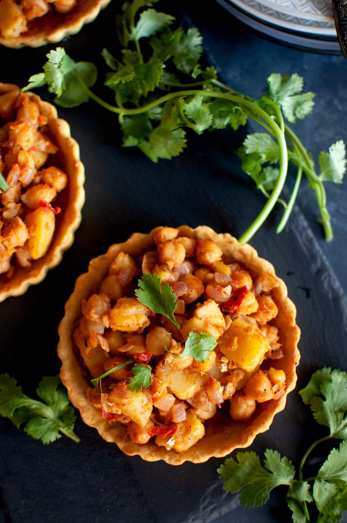 Top view of veggie tartlets with chickpea chaat