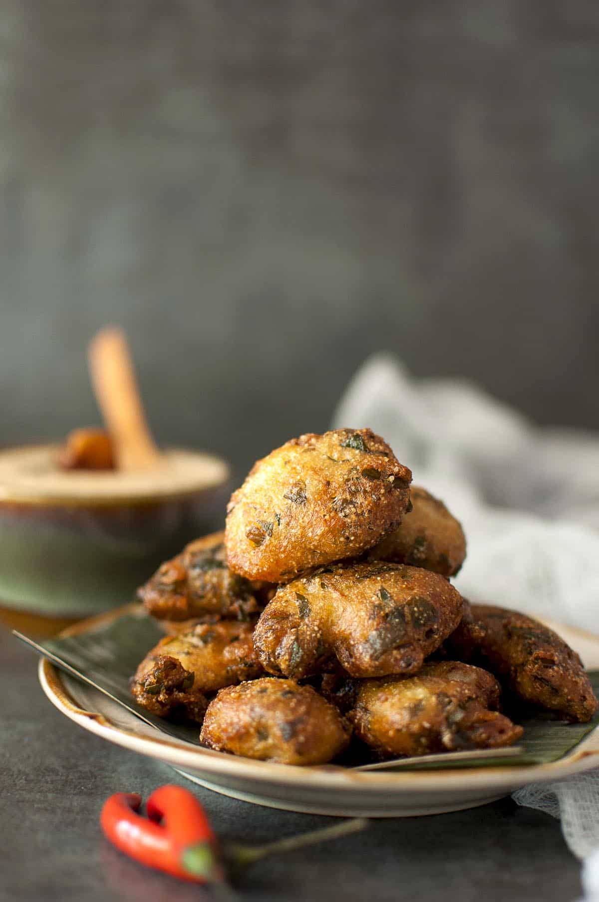 brown plate with crispy spinach fritters