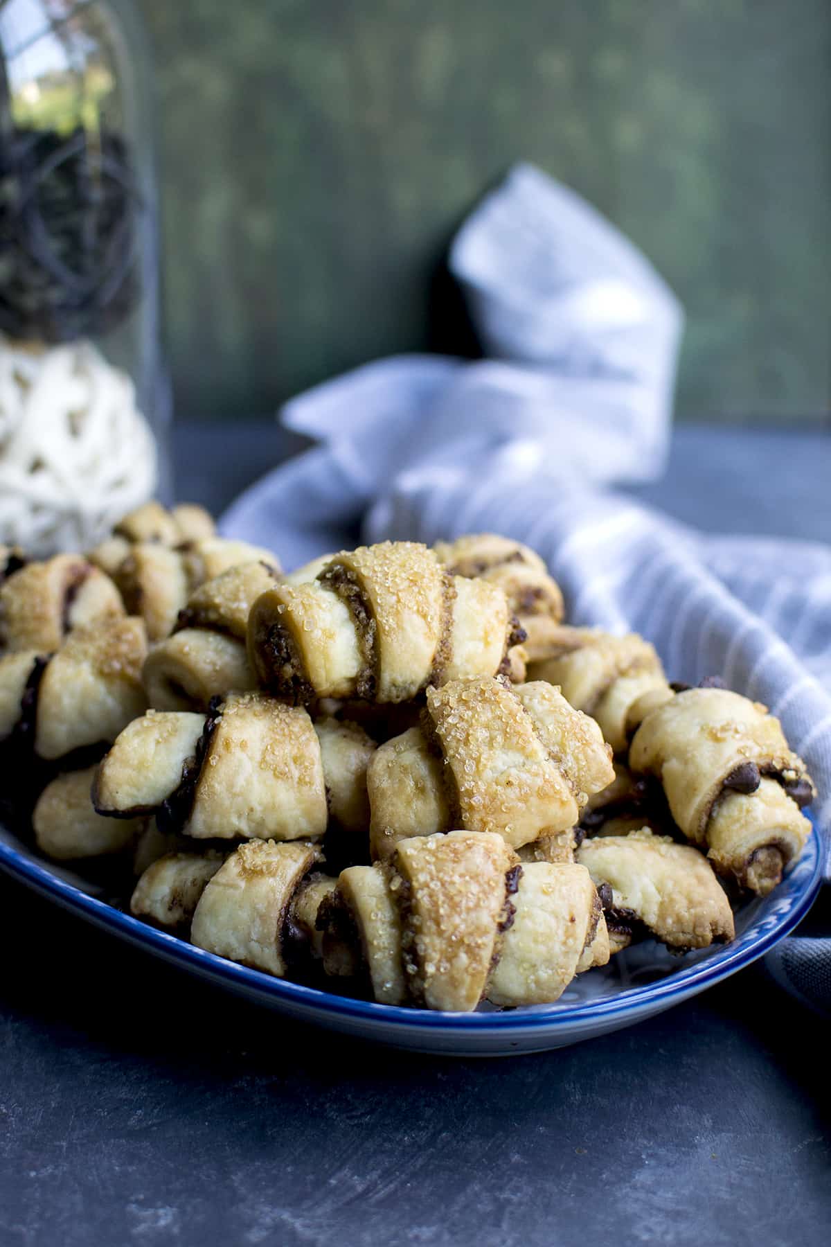 Blue bowl with a stack of cranberry-nut rugelach