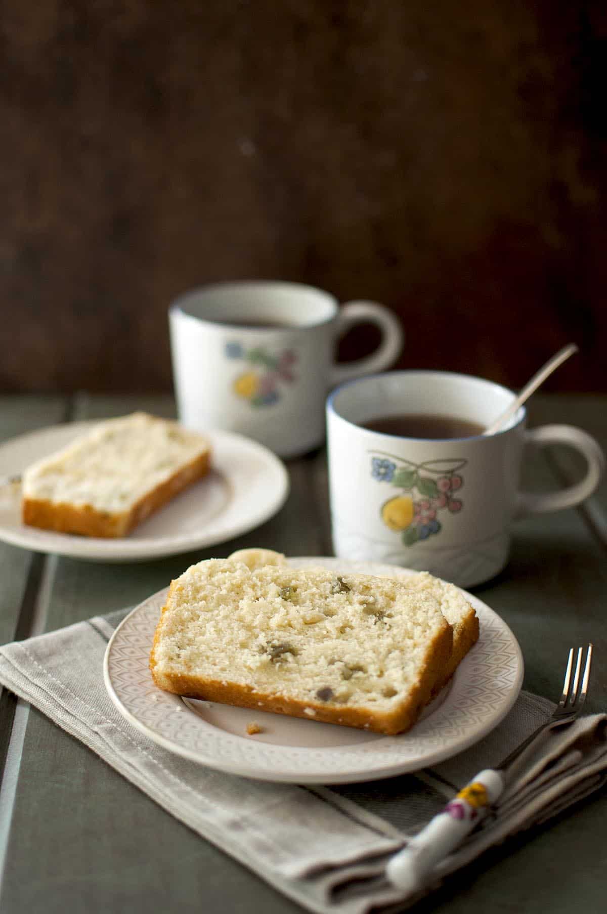 White plate with a slice of tea bread