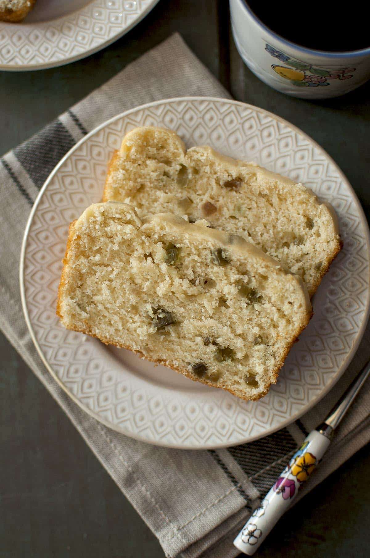 Top view of tutti fruity studded bread slices on a white plate