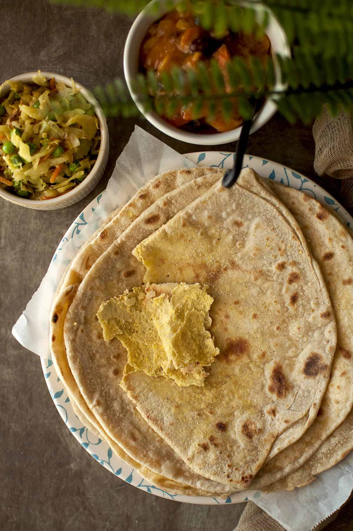 White plate with a stack of dal puri