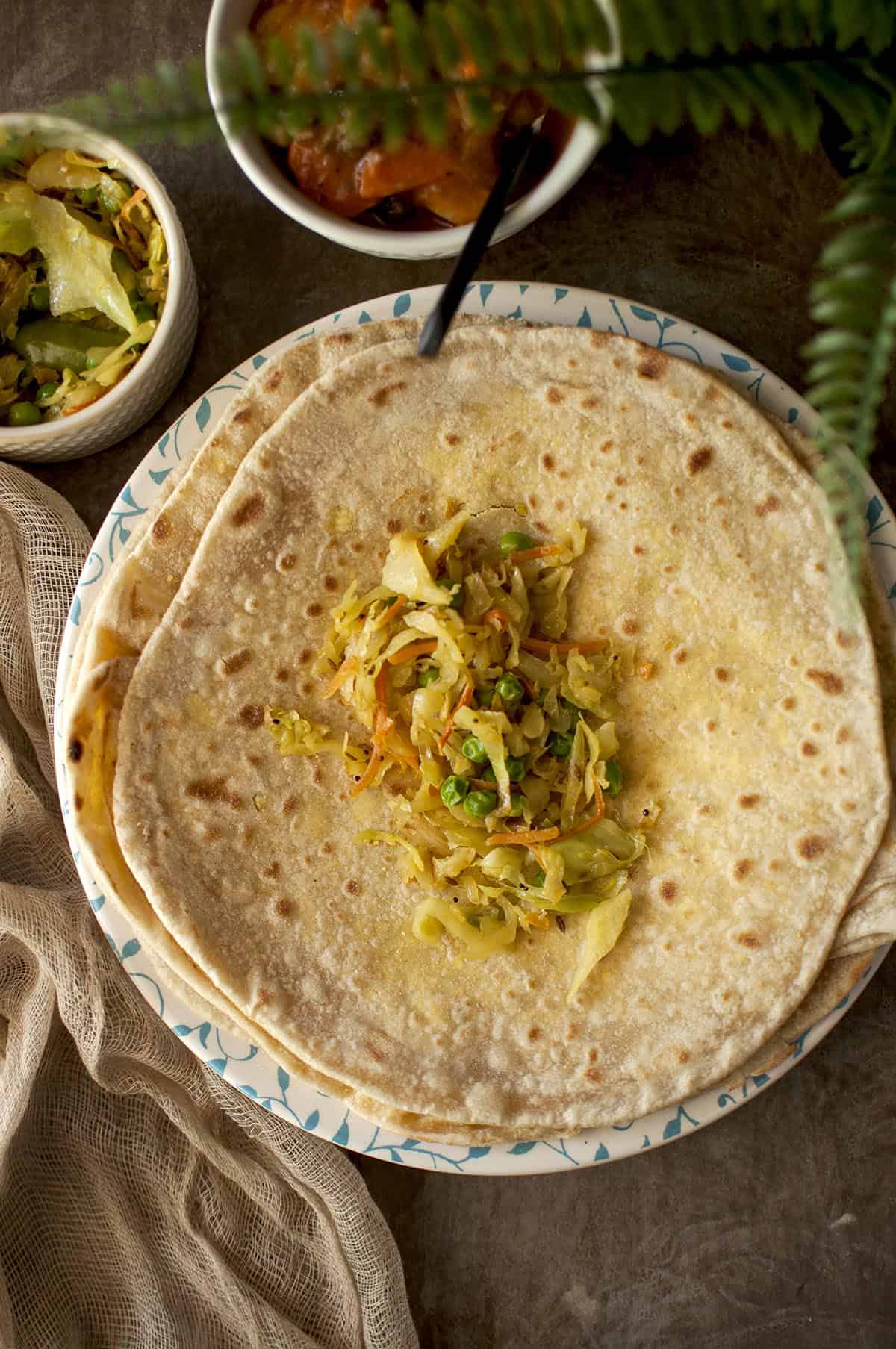 Dhal puri topped with cabbage curry