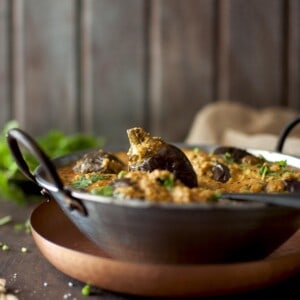 Bowl with stuffed eggplant curry.