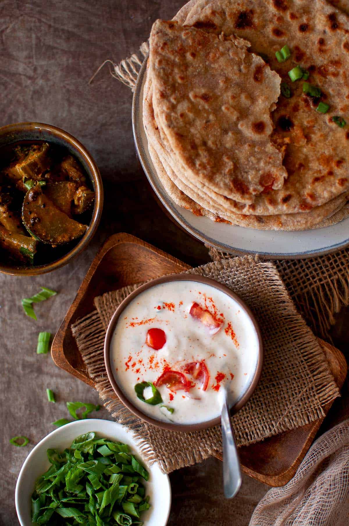 Top view of brown bowl with tomato raita