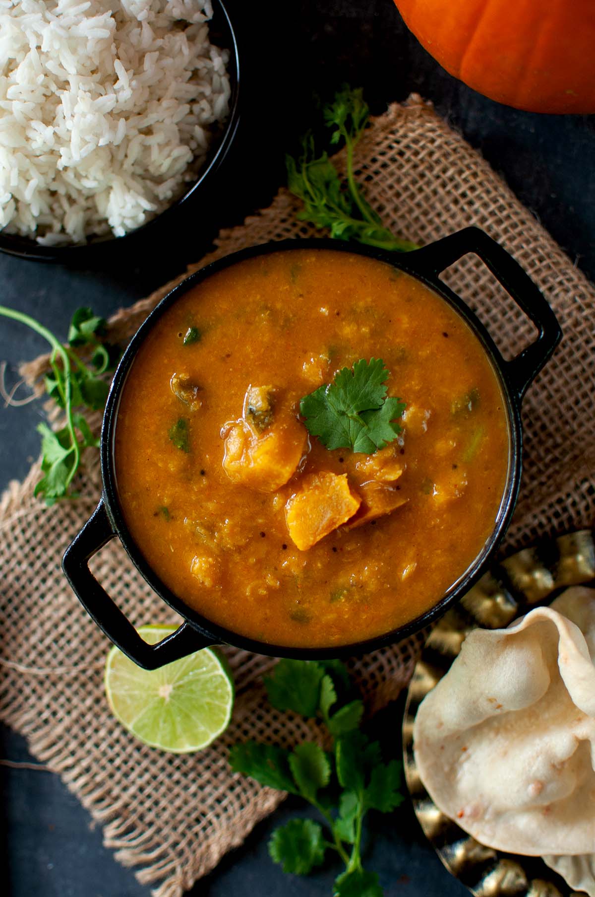 Top view of a black pan with South Indian stew