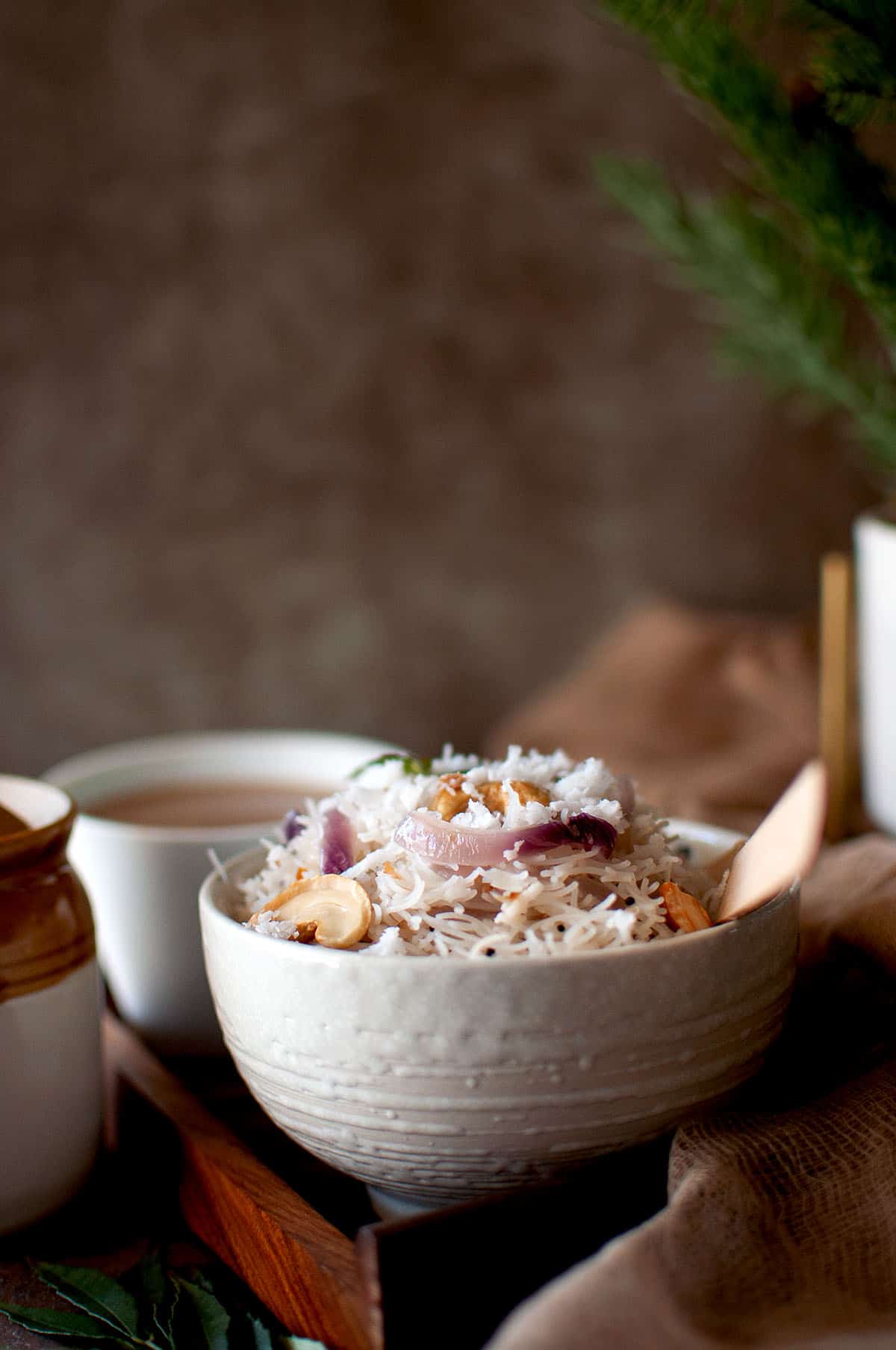 White bowl with thengai sevai.