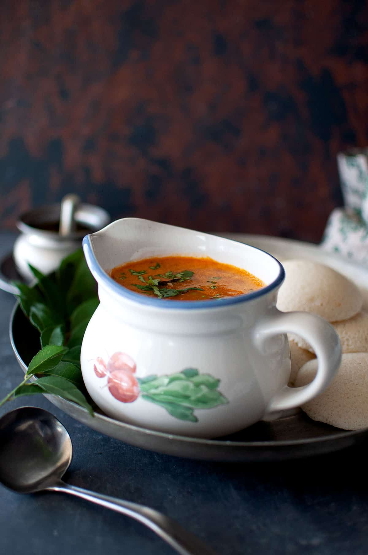 Tray with white bowl with Instant Sambar.