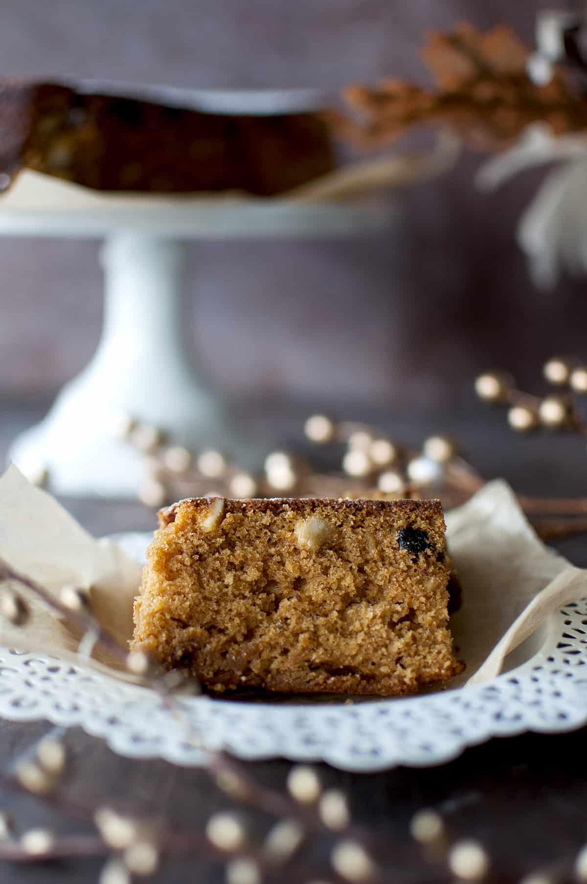 White plate with 2 slices of moist Kerala fruit cake