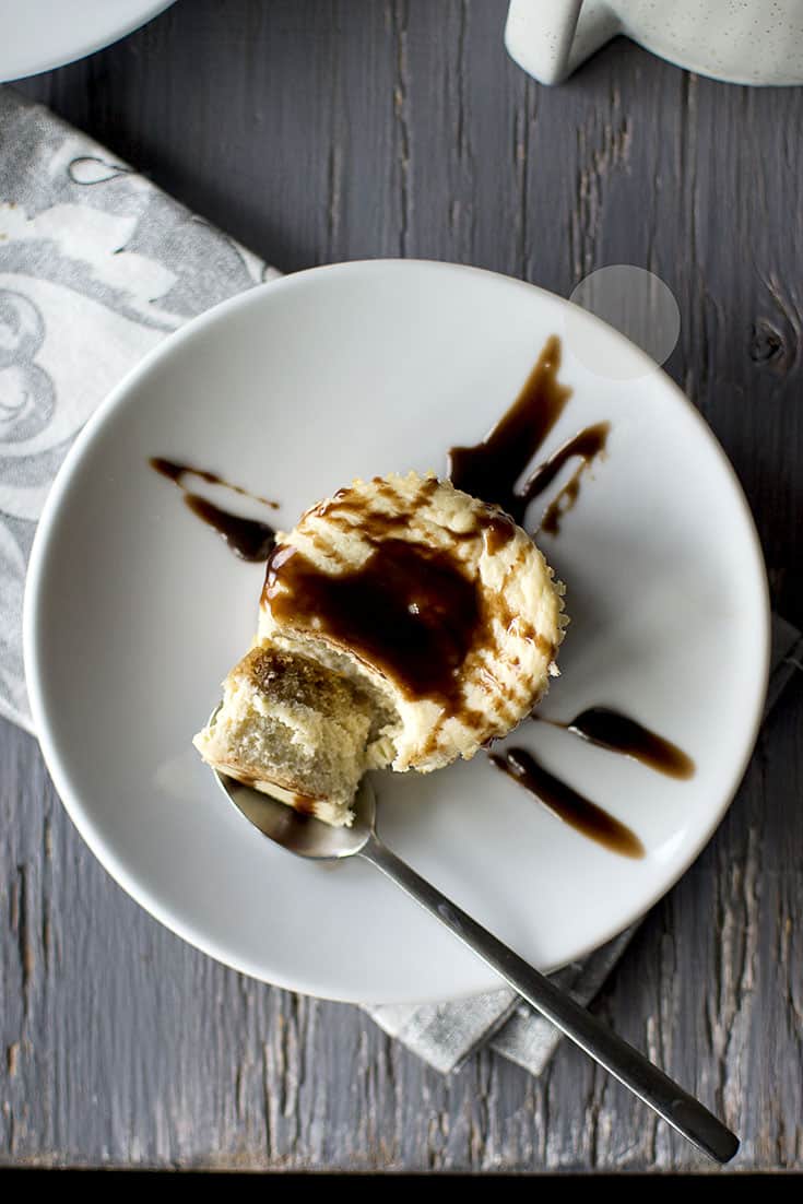 Mini Cheesecake with chocolate drizzle on a white plate