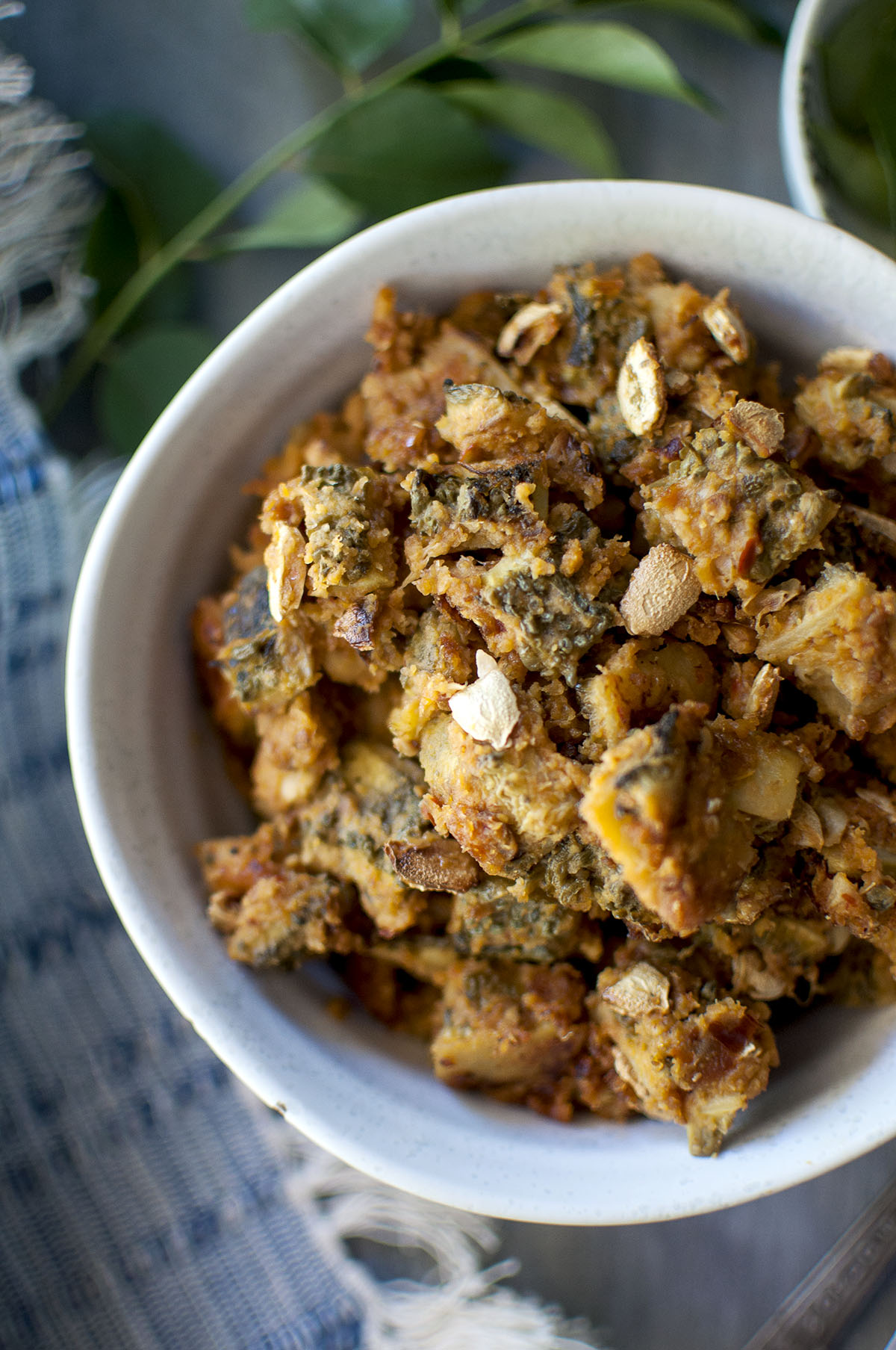 Grey bowl with spicy bitter gourd curry