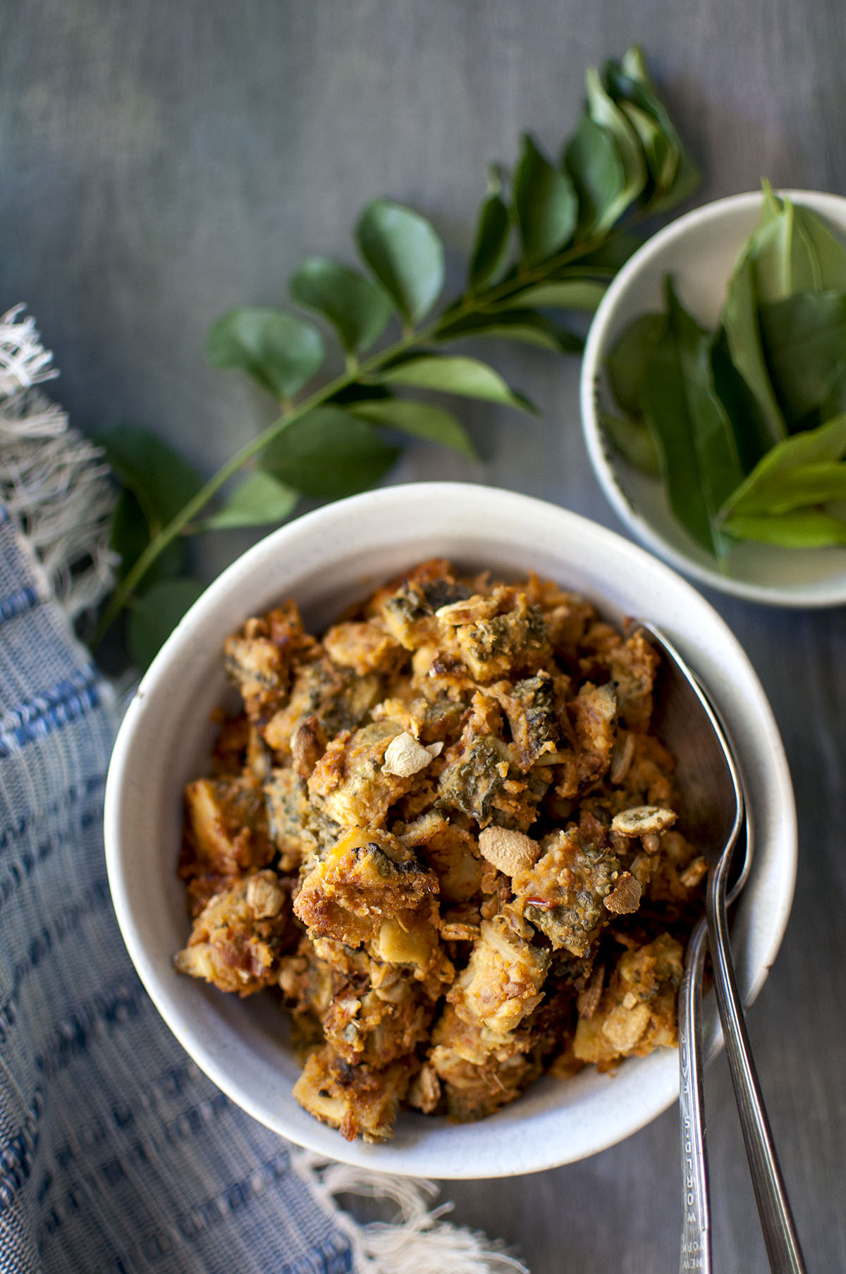 Grey bowl with bitter gourd curry 