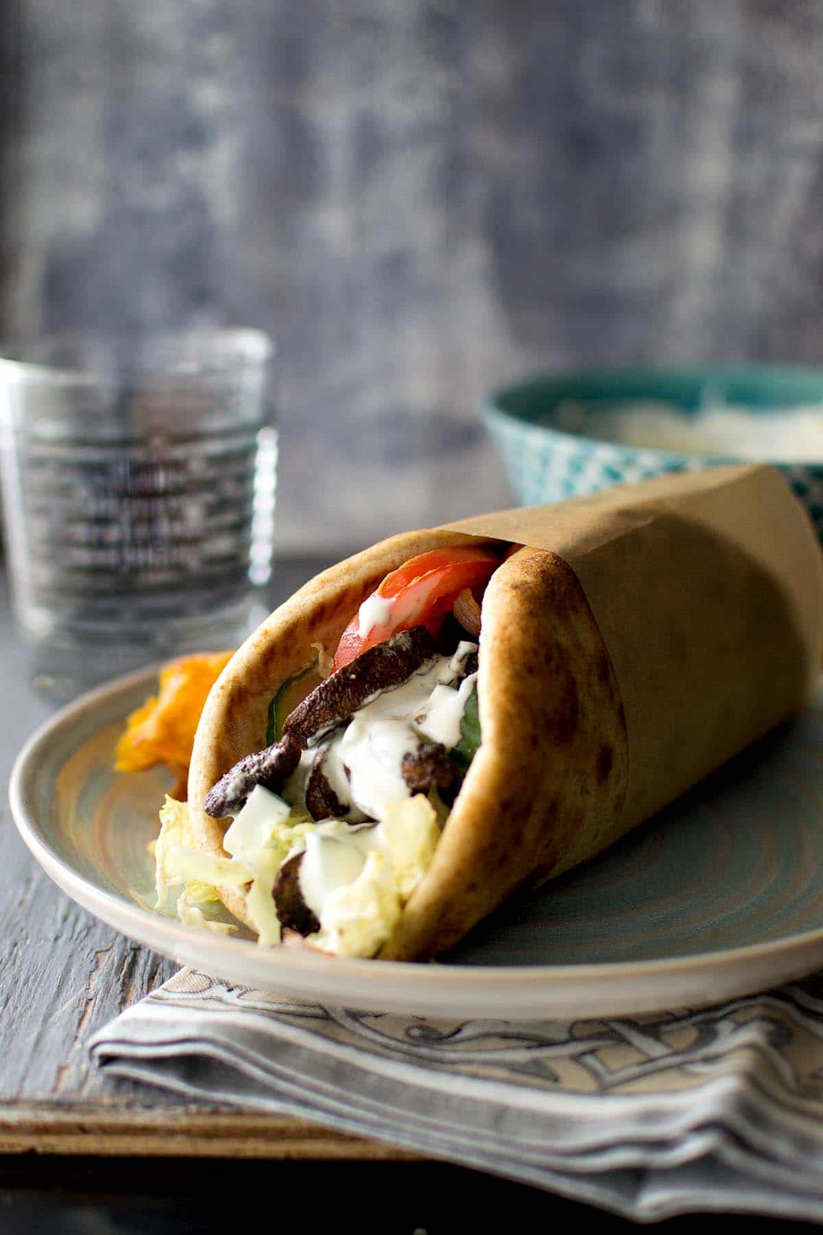 Blue plate with Greek mushroom pita sandwich