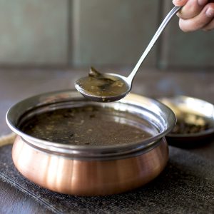 Copper bottom bowl with Pepper rasam.