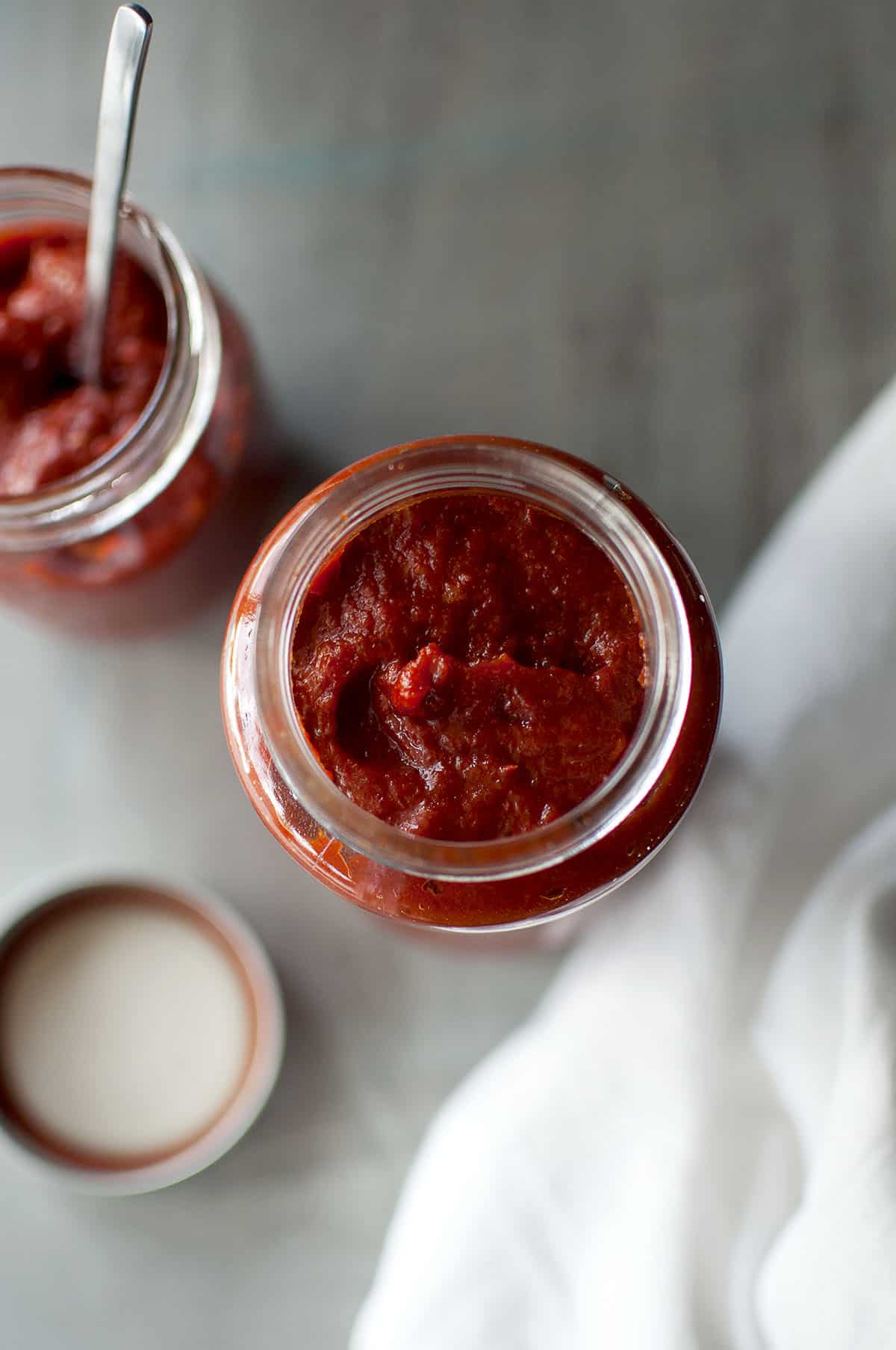 Top view of a glass jar with the spicy tomato concentrate