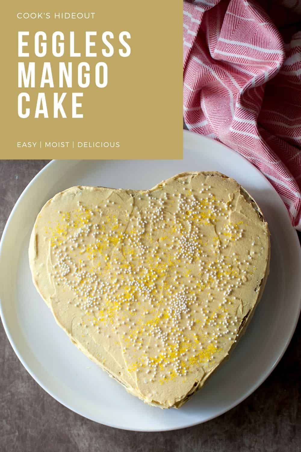 White plate with heart shaped eggless mango cake.